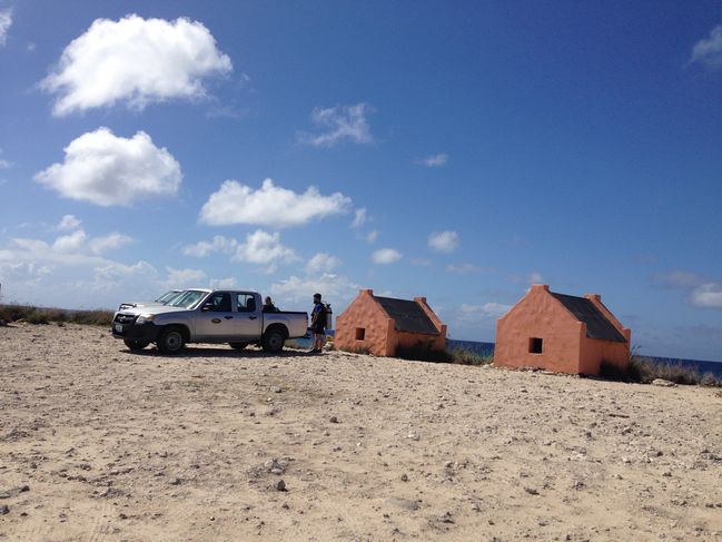 divers at orange slave huts
