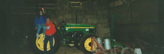 Helen and Paul 2001 with their first big tractor after making their own hay for the first year
