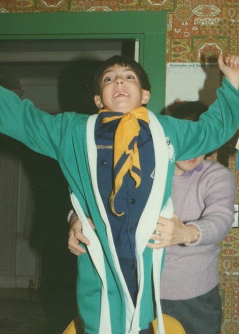 Nana at Peter's birthday ca 1991 with Celtics robe over cub scout uniform
