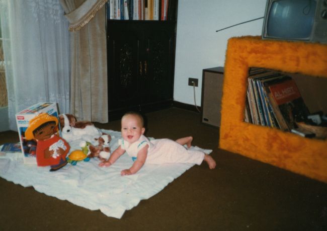 1983 Christmas visit:Jenny playing on living room floor
