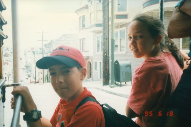 Papa and Peter hanging onto cable car in San Francisco
