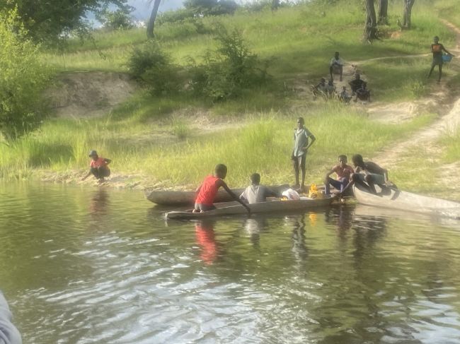 2/5/23 during evening river cruise from our lodge in Rundu, Namibia, children playing on the Angolan side of the river
