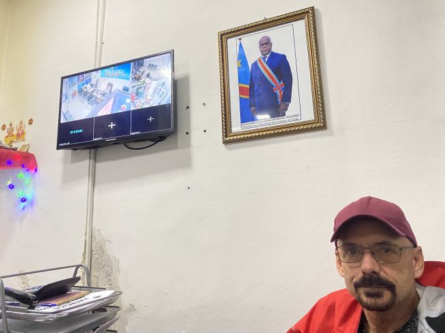 2/14/23 Ray Waiting inside our 'fixer' Ravi's office for various permits related to being allowed to leave Kinshasa
