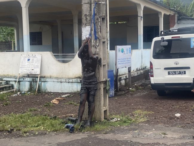 Sharia law punishment being enacted in Comoros.  He had old and snails on his body!!  Yikes.
