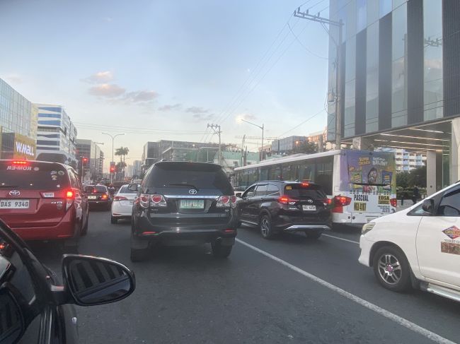 2/11 driving through modern Manila late afternoon
