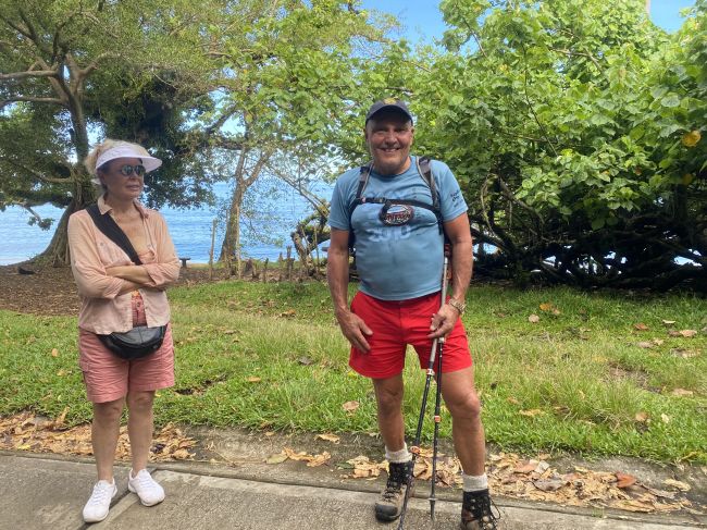 Tarman  and Laurie Johnson hiking to  ceremony in Ambryn, Vanuatu
