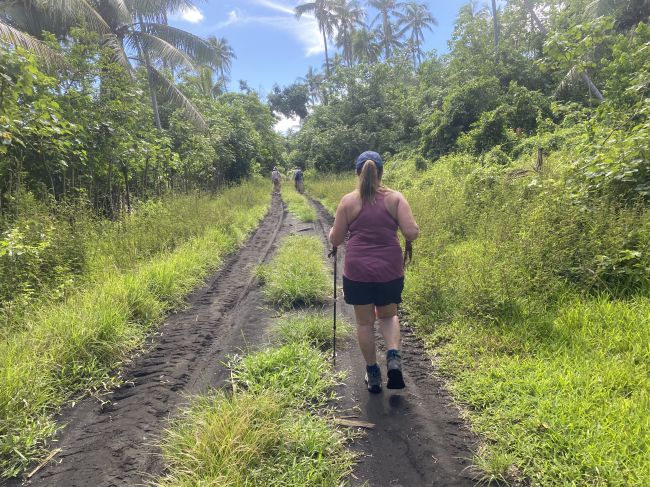 Mrs. Tarman  hiking to  ceremony in Ambryn, Vanuatu
