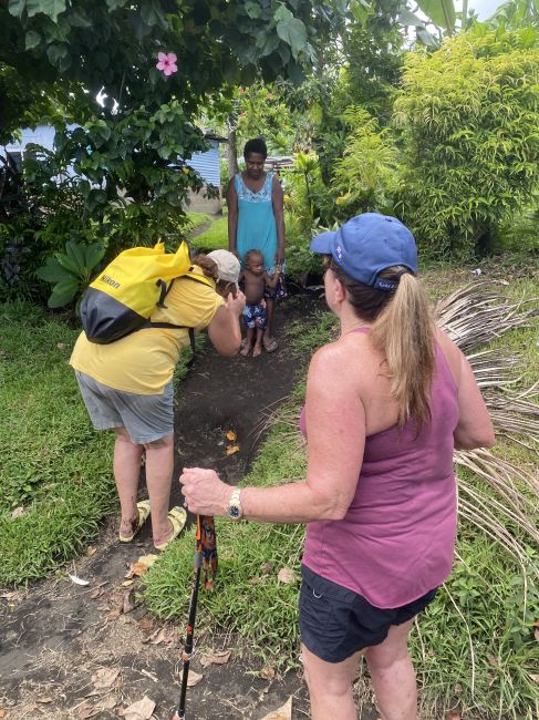 Chatting with locals in French during walk to ceremony on Ambryn, Vanuatu
