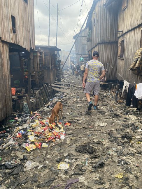11/5 Makoko, Ray Walking Away From World's Largest Floating Slum, Lagos, Nigeria
