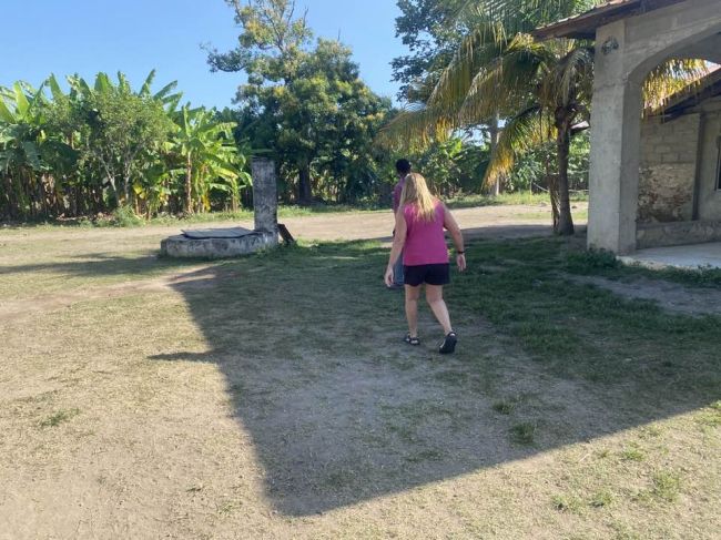 3/13 Helen approaching old French well
