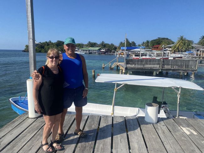 2/17 Paul and Helen waiting for the water taxi in Roatan
