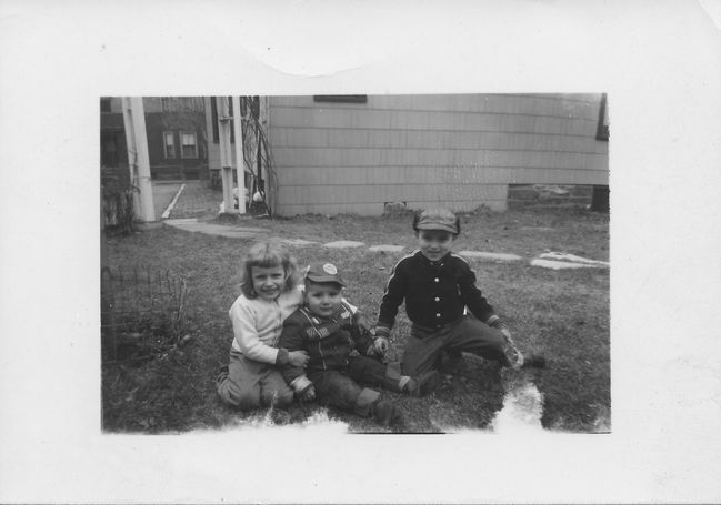 Uncle Paul's children Paula Lee, Walter and Scotty in Allston back yard
