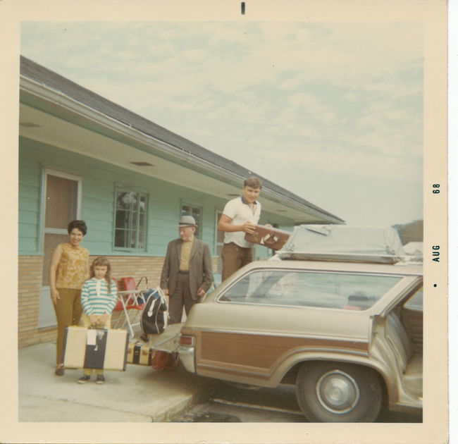 Lynn, Leslie, Emil, Paul loading 1966 Caprice station wagon on trip to Quebec 1968
