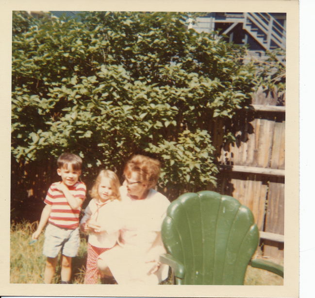 Danny and Elaine Holman with Greta Holman in 26 Adamson St. back yard
