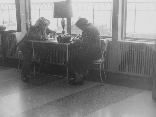 Emil and Hilma writing postcards home from NYC 1960
