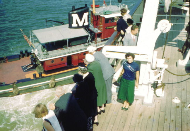 Moran Towing Tug easing the ship off of Pier 99 August 1952
