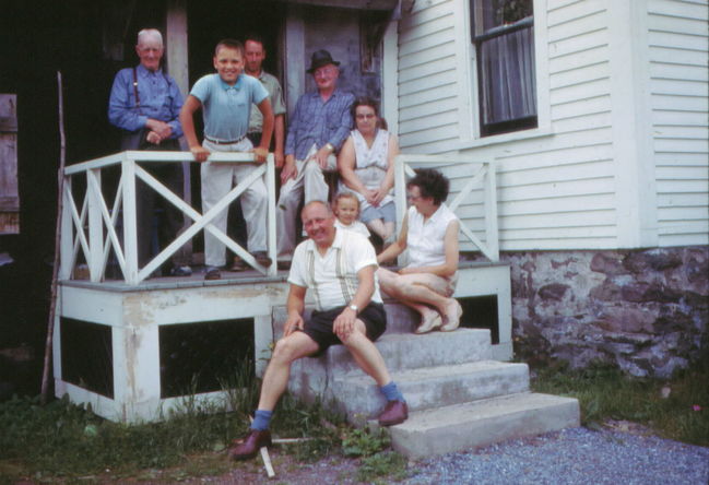 UNK, Paul, Lloyd, George, Ella, Greta, Leslie, Ake at Ella Tate's original house in Hampton, NB
