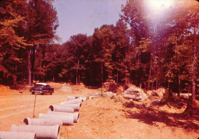 Cynthia Road 1959: Storm drain going into road 
