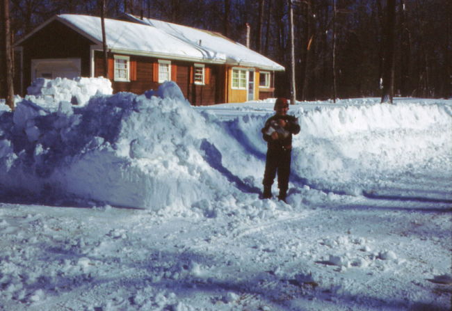 Paul holding Sonja in front of 13 Cynthia Road around 1961
