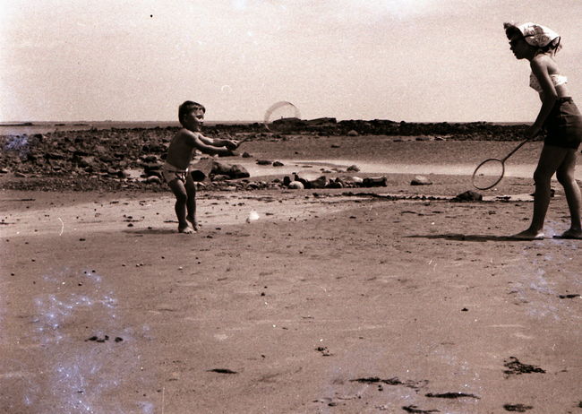 Lynne playing badminton with Paul on Wells Beach ca 1957
