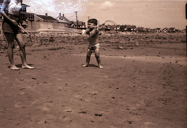 Lynne playing badminton with Paul on Wells Beach ca 1957
