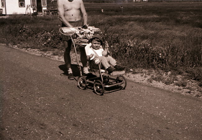 Ake and Paul on Eldredge Rd. in Wells Beach walking past Stick-In-The-Mud ca 1956
