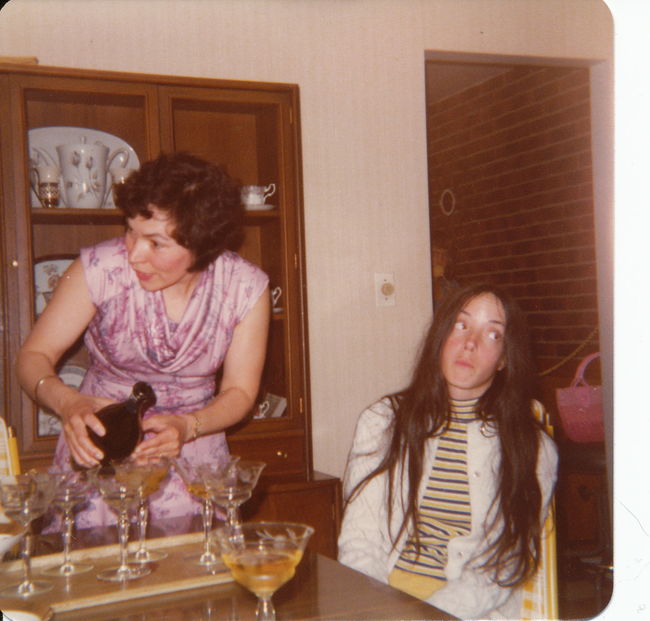 Helen looking forward to a drink in 13 Cynthia living room ca 1980
