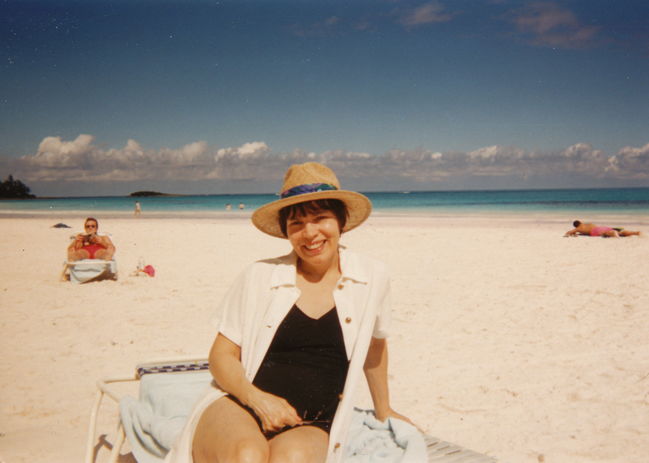 Lynne on beach in Puerto Rico on vacation with family
