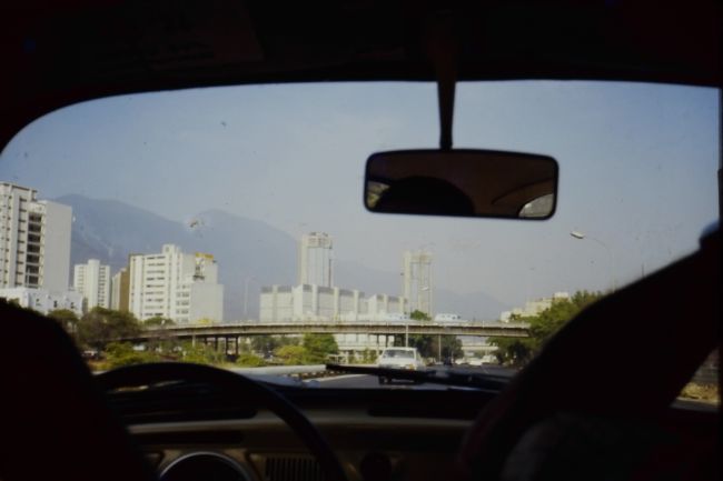 Driving through the autopista cutting through the central valley of Caracas in my 1966 VW Beetle
