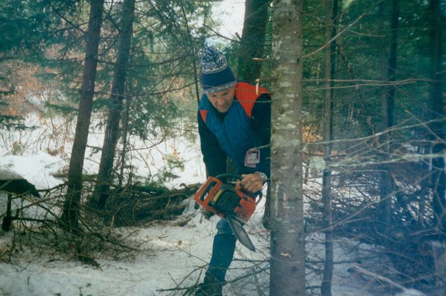 Paul cutting Christmas tree at Limerick Dec. 1997
