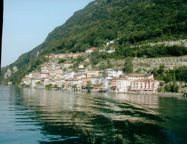 View of Ciluffo's agglomeration on shore of Lake Lugano take from ferry boat
