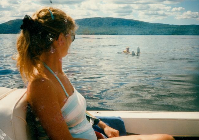 Judy Tucker Curran Buck on our boat at Newfound Lake with her son Jim (or Jack) trying to water ski
