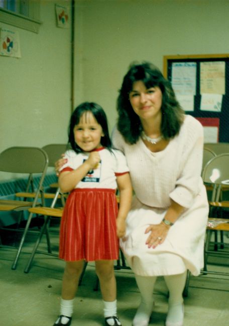 Jenny at her pre-school graduation with Teacher Jackie Estes
