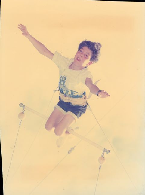 10 year old Peter on trapeze at a club med
