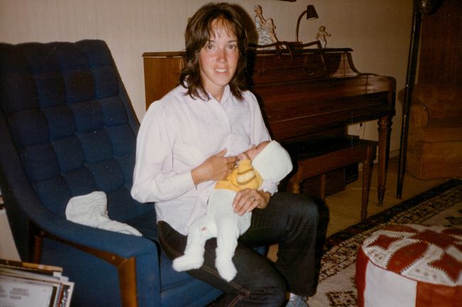 Helen with baby Peter in 13 Cynthia Road living room
